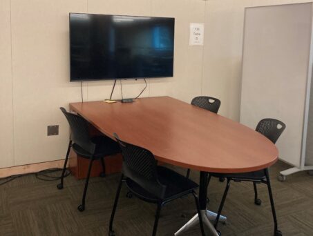 Table with chairs and screen. Click on this picture to reserve this space.