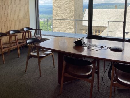 Room with large window and table with chairs. Click on this picture to reserve this room.
