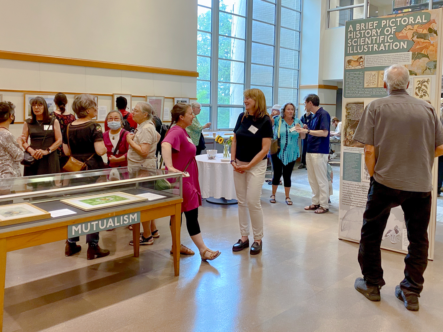 Viewers at the Sept. 12 exhibit reception